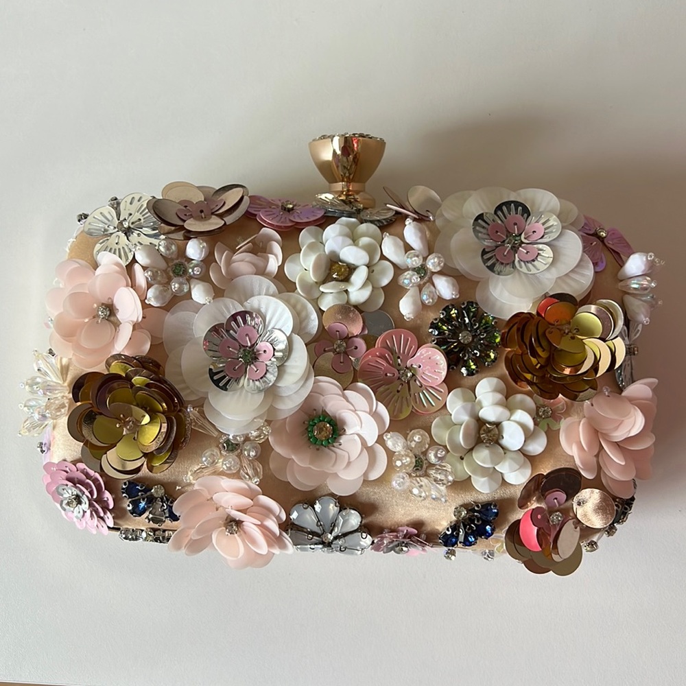 Embellished clutch with 3D flowers, sequins, beading and rhinestones.